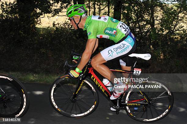 Green jersey of best sprinter, Belgium's Philippe Gilbert, rides during the 198 km and third stage of the 2011 Tour de France cycling race run...