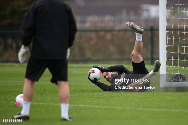 Goalkeeper Rob Elliot dives to make a save during the Newcastle United Training Session at the Newcastle United Training Centre on October 16, 2019...