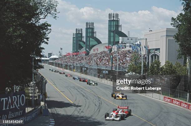Helio Castroneves of Brazil drives the Marlboro Team Penske Reynard 01i Honda HRK ahead of the field at the start of the Championship Auto Racing...