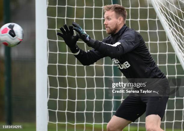 Goalkeeper Rob Elliot catches the ball during the Newcastle United Training Session at the Newcastle United Training Centre on October 16, 2019 in...