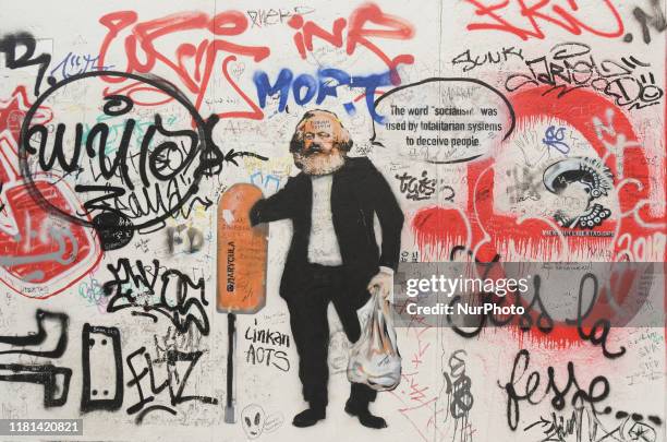 Graffiti of Karl Marx seen on a still-standing section of the former Berlin Wall called the East Side Gallery, of the Berlin Wall. On Saturday,...