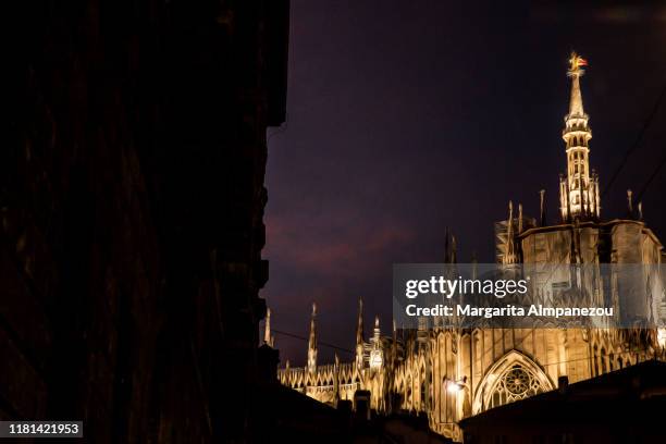 discovering milan: duomo illuminated by night - milan night stock pictures, royalty-free photos & images