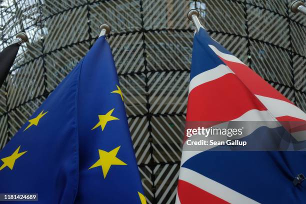 The flags of the European Union and the United Kingdom hang one day prior to a summit of European Union leaders at the European Council on October...