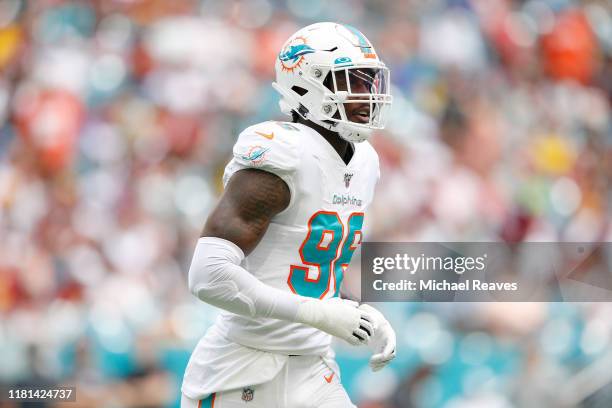 Taco Charlton of the Miami Dolphins looks on against the Washington Redskins during the first quarter at Hard Rock Stadium on October 13, 2019 in...