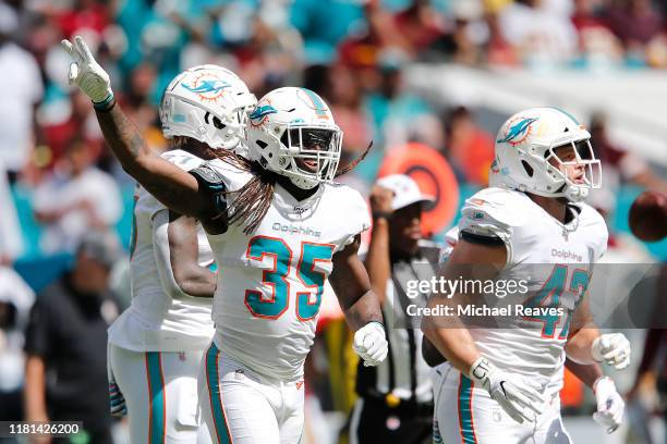 Walt Aikens of the Miami Dolphins celebrates after a successful fake punt against the Washington Redskins during the first quarter at Hard Rock...