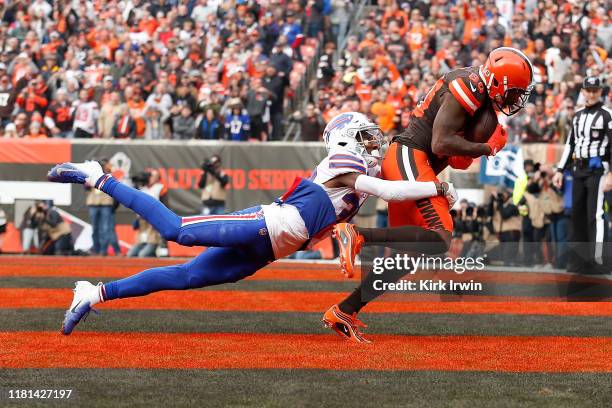 Jarvis Landry of the Cleveland Browns catches a pass for a touchdown while being defended by Levi Wallace of the Buffalo Bills during the first...