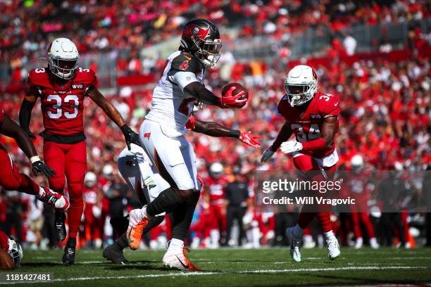Ronald Jones of the Tampa Bay Buccaneers crosses the goal line to score a touchdown in the first quarter the game against the Arizona Cardinals on...