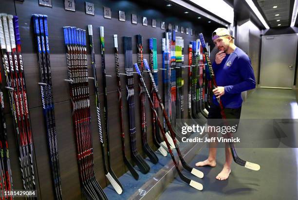 Sven Baertschi of the Vancouver Canucks checks his sticks before their NHL game against the New Jersey Devils at Rogers Arena November 10, 2019 in...