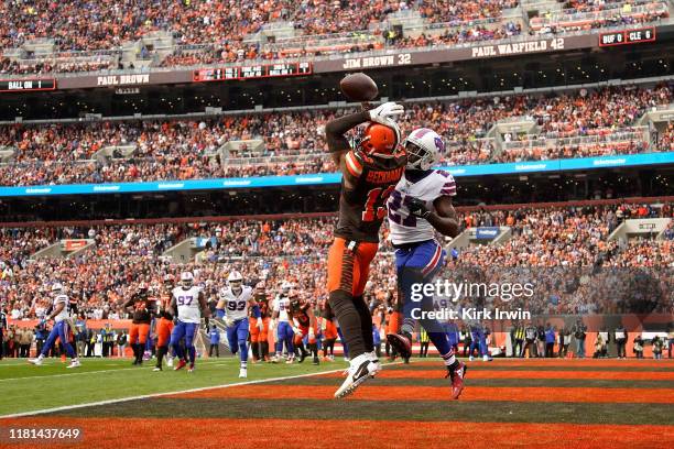 TreDavious White of the Buffalo Bills breaks up a pass intended for Odell Beckham Jr. #13 of the Cleveland Browns in the end zone during the first...