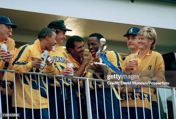 The Warwickshire team celebrate with the trophy after securing the Axa Equity and Law league title after defeating Gloucestershire by 46 runs at the...