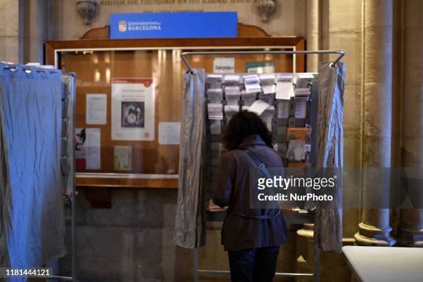 Woman prepare their ballots at a polling station in the University of Barcelona during a general election in Spain, in Barcelona on November 10th,...