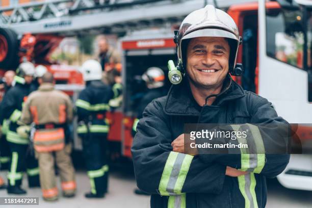 firefighter's portrait - fire fighting stock pictures, royalty-free photos & images