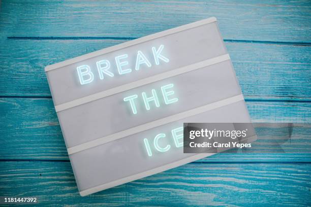 break the ice in neon lights - rompere il ghiaccio foto e immagini stock
