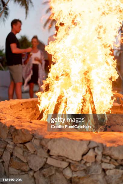 close up of a bonfire at a beach party - bonfire beach stock pictures, royalty-free photos & images