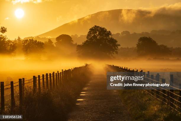 keswick - mist - weather - golden light - sunrise - lake district - uk - cumbrian mountains stock pictures, royalty-free photos & images