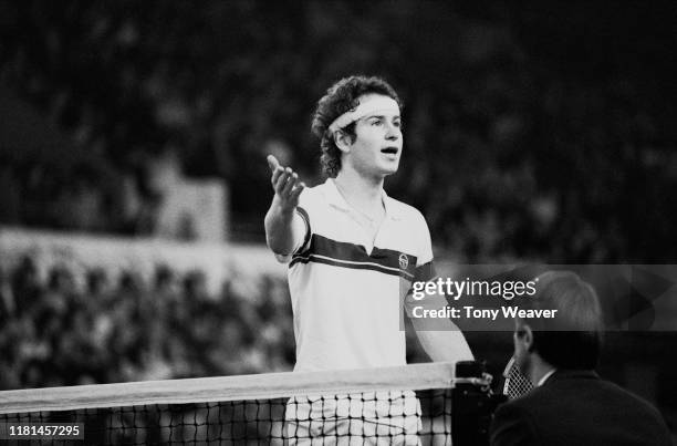 American tennis player John McEnroe talks to the referee during a match at the Benson & Hedges Tennis Championships, Wembley Arena, London, UK, 13th...