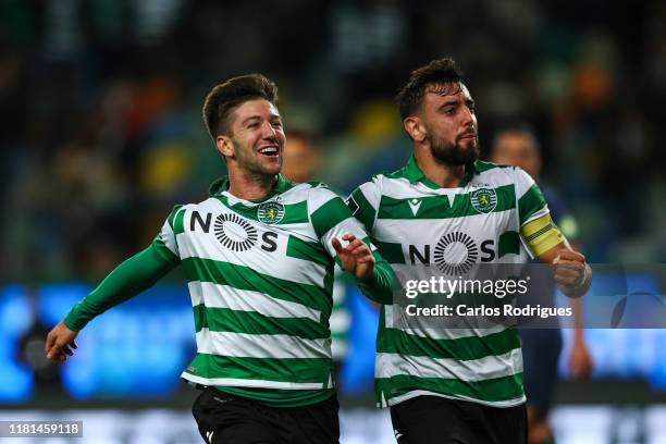 Luciano Vietto of Sporting CP celebrates scoring Sporting CP second with Bruno Fernandes of Sporting CP goal during the Liga Nos round 11 match...