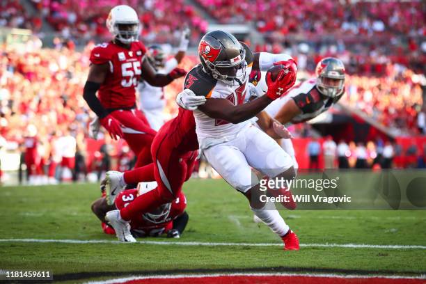 Peyton Barber of the Tampa Bay Buccaneers crosses the goal line for a touchdown in the fourth quarter during the game against the Arizona Cardinals...