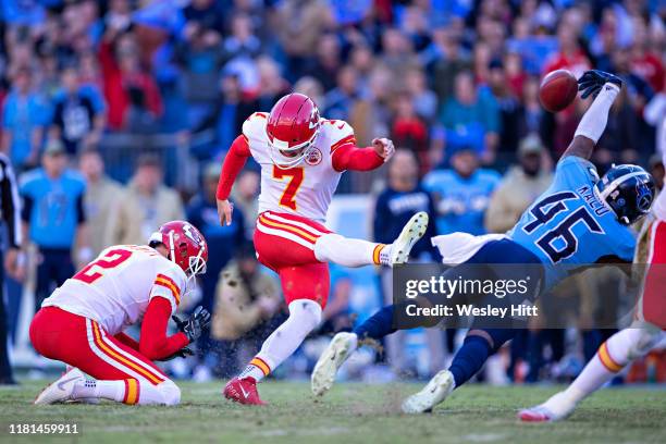 Joshua Kalu of the Tennessee Titans blocks a game tying field goal attempt at the end of the game by Harrison Butker of the Kansas City Chiefs at...