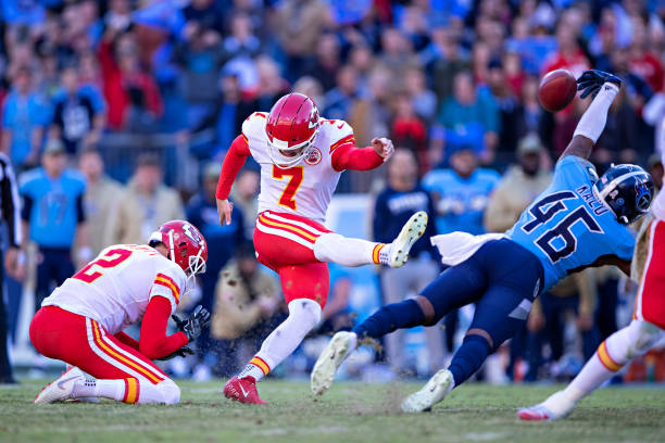Joshua Kalu of the Tennessee Titans blocks a game tying field goal attempt at the end of the game by Harrison Butker of the Kansas City Chiefs at...