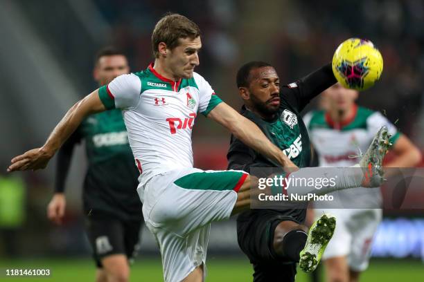 Dmitri Zhivoglyadov of FC Lokomotiv Moscow and Manuel Fernandes of FC Krasnodar vie for the ball during the Russian Football League match between FC...