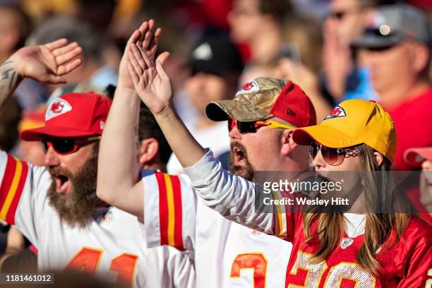 Fans of the Kansas City Chiefs do the tomahawk chop in the second half of a game against the Tennessee Titans at Nissan Stadium on November 10, 2019...