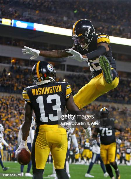 James Washington of the Pittsburgh Steelers celebrates with Diontae Johnson after catching a 3 yard touchdown pass in the first half against the Los...