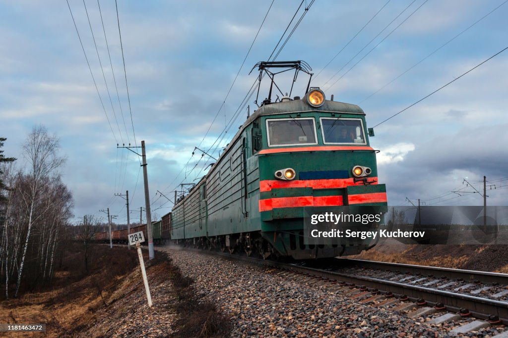 Powerful electric locomotive with freight train
