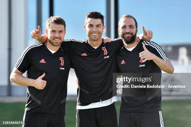 Juventus players Aaron Ramsey, Cristiano Ronaldo and Gonzalo Higuain during a training session at JTC on October 16, 2019 in Turin, Italy.