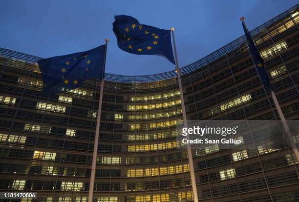 Flags of the European Union fly outside the Berlaymont building of the European Commission where EU and British negotiators met throughout the day...