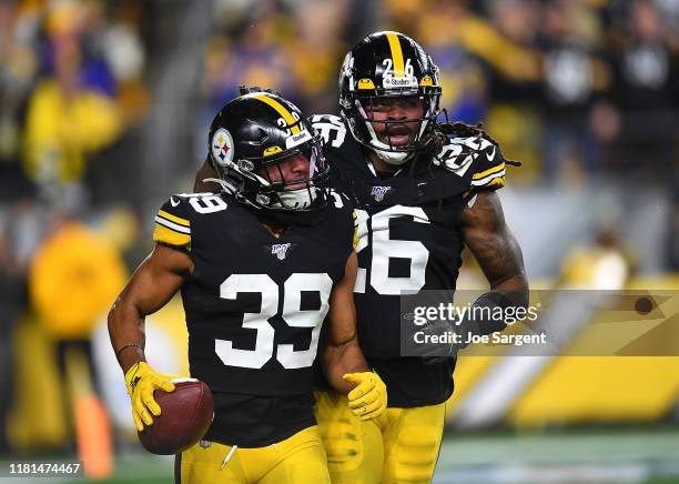 Minkah Fitzpatrick of the Pittsburgh Steelers celebrates with Mark Barron after recovering a fumble for a 43 yard touchdown during the second quarter...