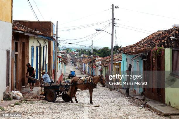 Horse drawn carriage on a cobblestone street in Trinidad on October 8, 2019 in Trinidad, Cuba. Trinidad is a town in the province of Sancti Spíritus,...