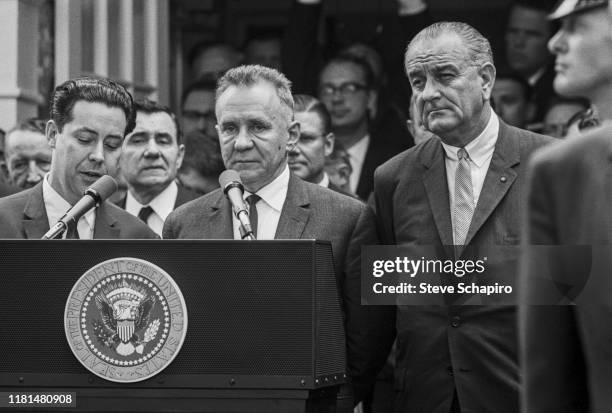 Soviet Premier Alexei Kosygin and American President Lyndon Johnson stand at a lectern during the Glassboro Summit Conference, on the campus of...