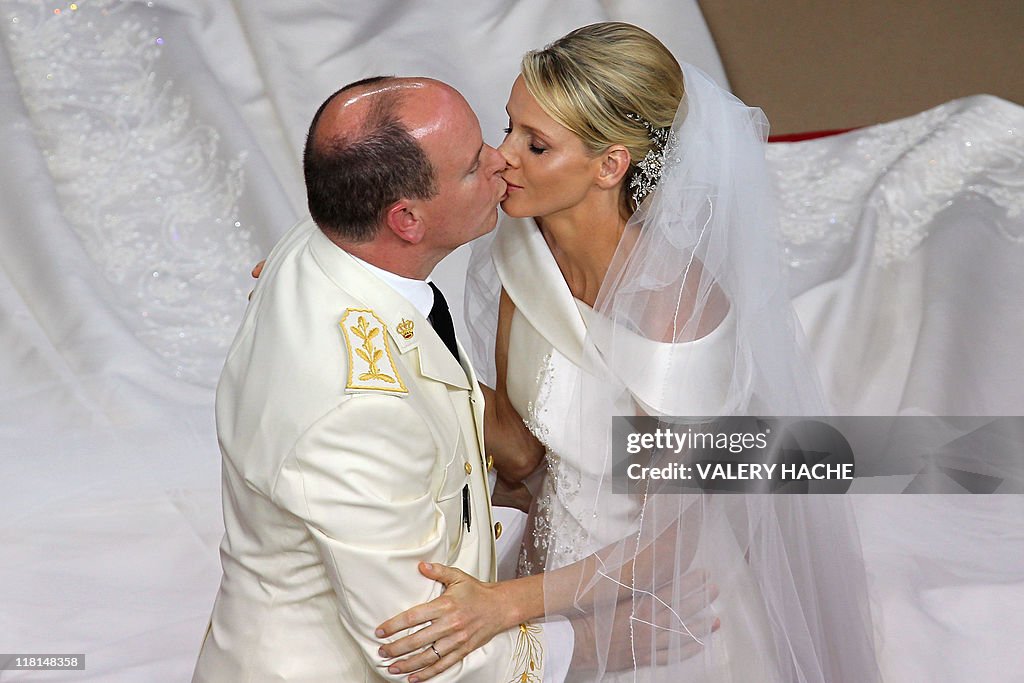 Prince Albert II of Monaco kisses Prince
