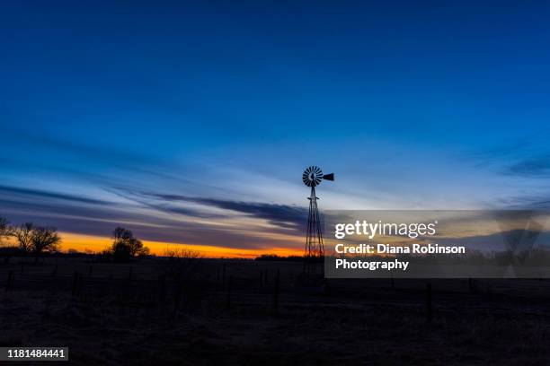 windmill at sunrise near gibbon, nebraska - gibbon stock pictures, royalty-free photos & images