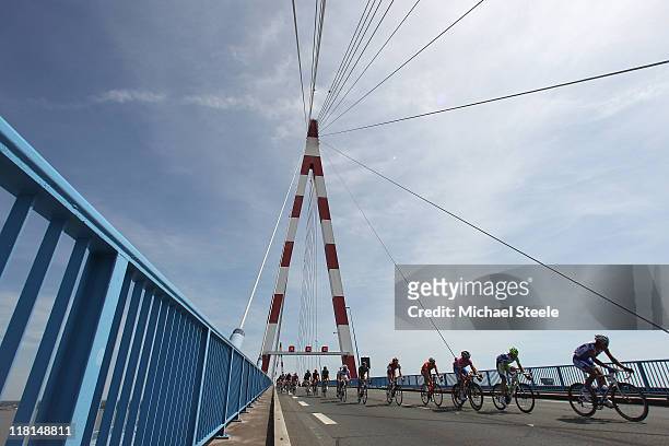 The peloton makes its way over a bridge towards St Nazaire during Stage 3 of the 2011 Tour de France from Olonne sur Mer to Redon on July 4, 2011 in...