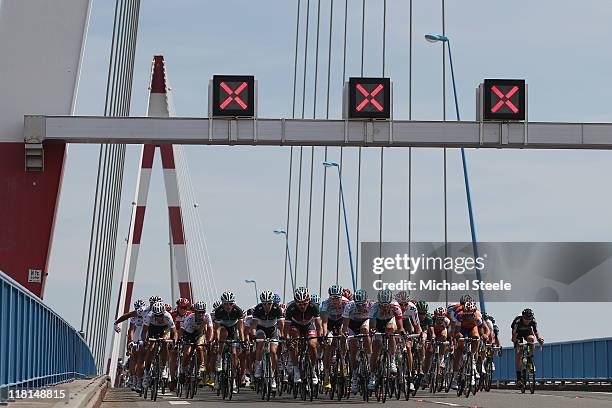 The peloton makes its way over a bridge towards St Nazaire during Stage 3 of the 2011 Tour de France from Olonne sur Mer to Redon on July 4, 2011 in...