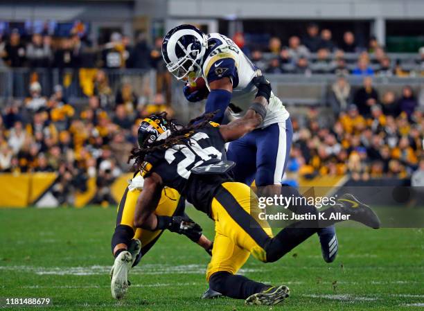 Gerald Everett of the Los Angeles Rams runs after the catch against Mark Barron of the Pittsburgh Steelers on November 10, 2019 at Heinz Field in...