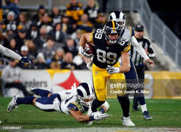 Vance McDonald of the Pittsburgh Steelers runs after the catch against Taylor Rapp of the Los Angeles Rams on November 10, 2019 at Heinz Field in...