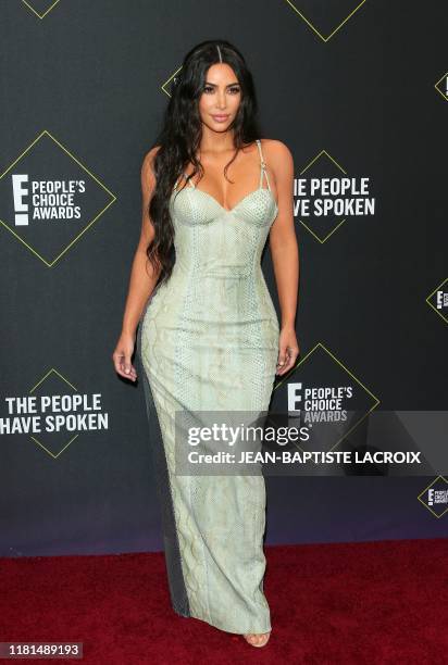 Business woman/media personality Kim Kardashian arrives for the 45th annual E! People's Choice Awards at Barker Hangar in Santa Monica, California,...