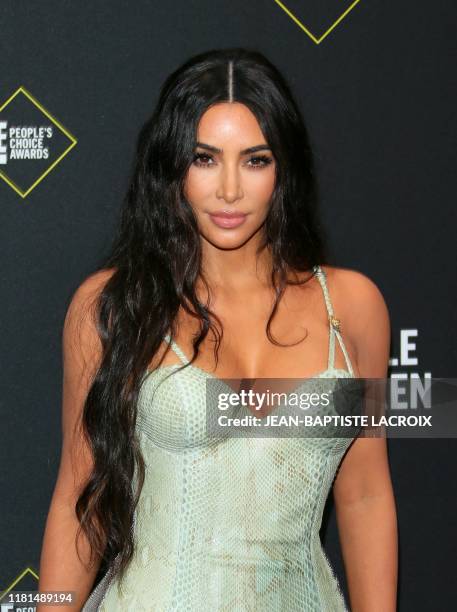 Business woman/media personality Kim Kardashian arrives for the 45th annual E! People's Choice Awards at Barker Hangar in Santa Monica, California,...