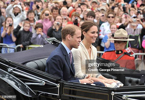 Catherine, Duchess of Cambridge and Prince William, Duke of Cambridge arrive by carriage as they visit the Province House on July 5, 2011 in...