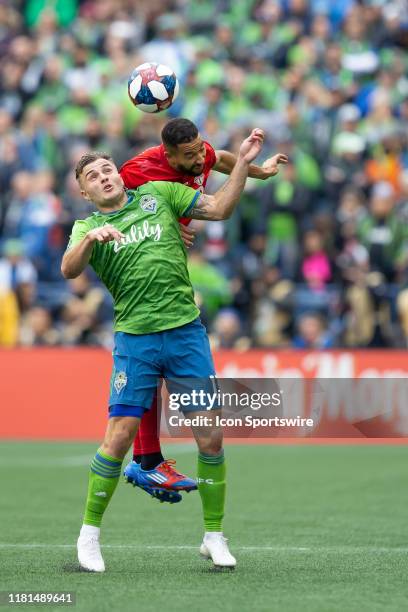 Seattle Sounders forward Jordan Morris tries to head the ball in front of a Toronto FC player during the second half of the Major League Soccer Cup...