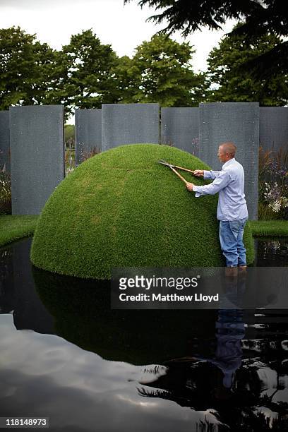 Sim Flemons poses for pictures in The World Vision charity garden at the 2011 Hampton Court Palace Flower Show on July 4, 2011 in London, England....