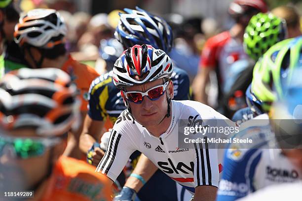 Bradley Wiggins of Great Britain and team Sky Procycling waits ahead of the start of Stage 3 of the 2011 Tour de France from Olonne sur Mer to Redon...