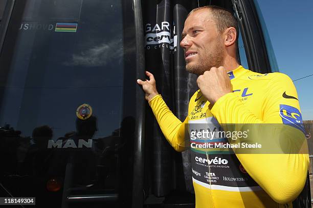 Thor Hushovd of Norway and holder of the yellow jersey representing team Garmin emerges from the team bus ahead of Stage 3 of the 2011 Tour de France...