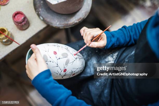 artist painting ceramica - traditional japanese painting stock pictures, royalty-free photos & images