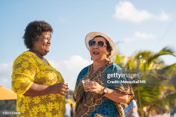 women drinking beer at the beach - chubby granny stock pictures, royalty-free photos & images