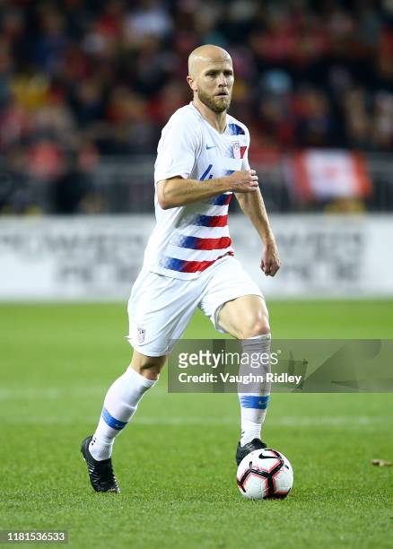 Michael Bradley of the United States dribbles the ball during a CONCACAF Nations League game against Canada at BMO Field on October 15, 2019 in...