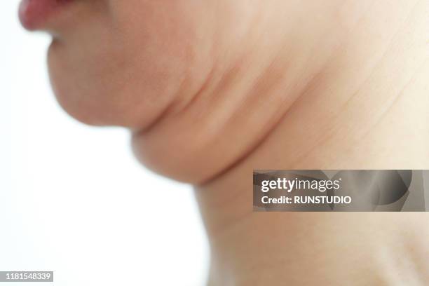 mature woman's double chin,close up - double chin stock-fotos und bilder